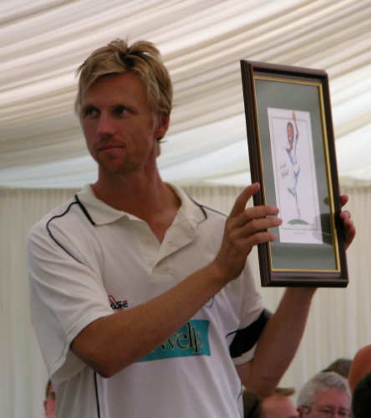 Alan Mullally helps out at the lunch time auction