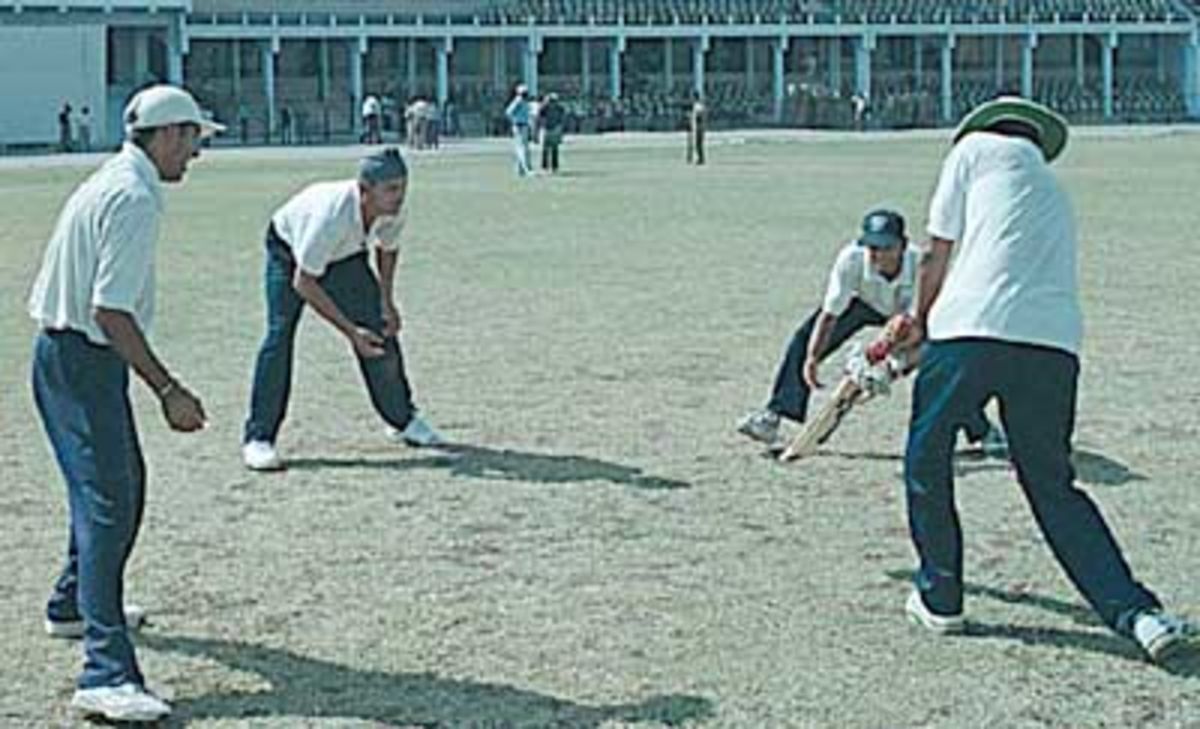 Raj Singh Dungarpur giving catch practice to Sodhi,Doru, Gambhir and