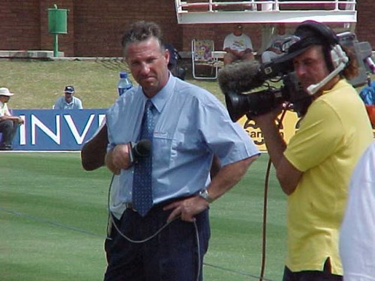 Former England all-rounder Ian Botham prepares to do his pitch report.  Botham is commentating for TV on the England tour of South Africa.  Taken during the Port Elizabeth Test match. (11 December 1999)