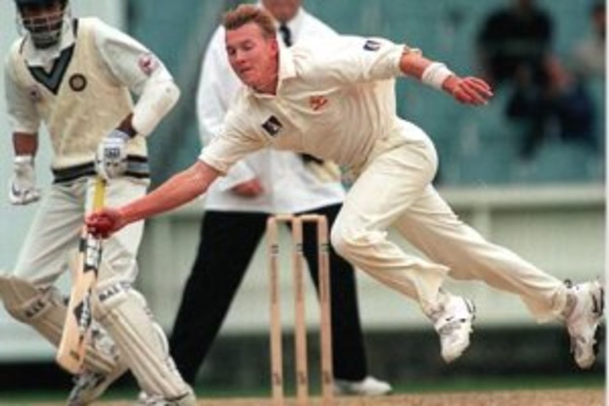 28 Dec 1999: Australian pace bowler Brett Lee fields off his own bowling, on day three of the second test match between Australia and India, played at the Melbourne Cricket Ground, Melbourne, Australia.