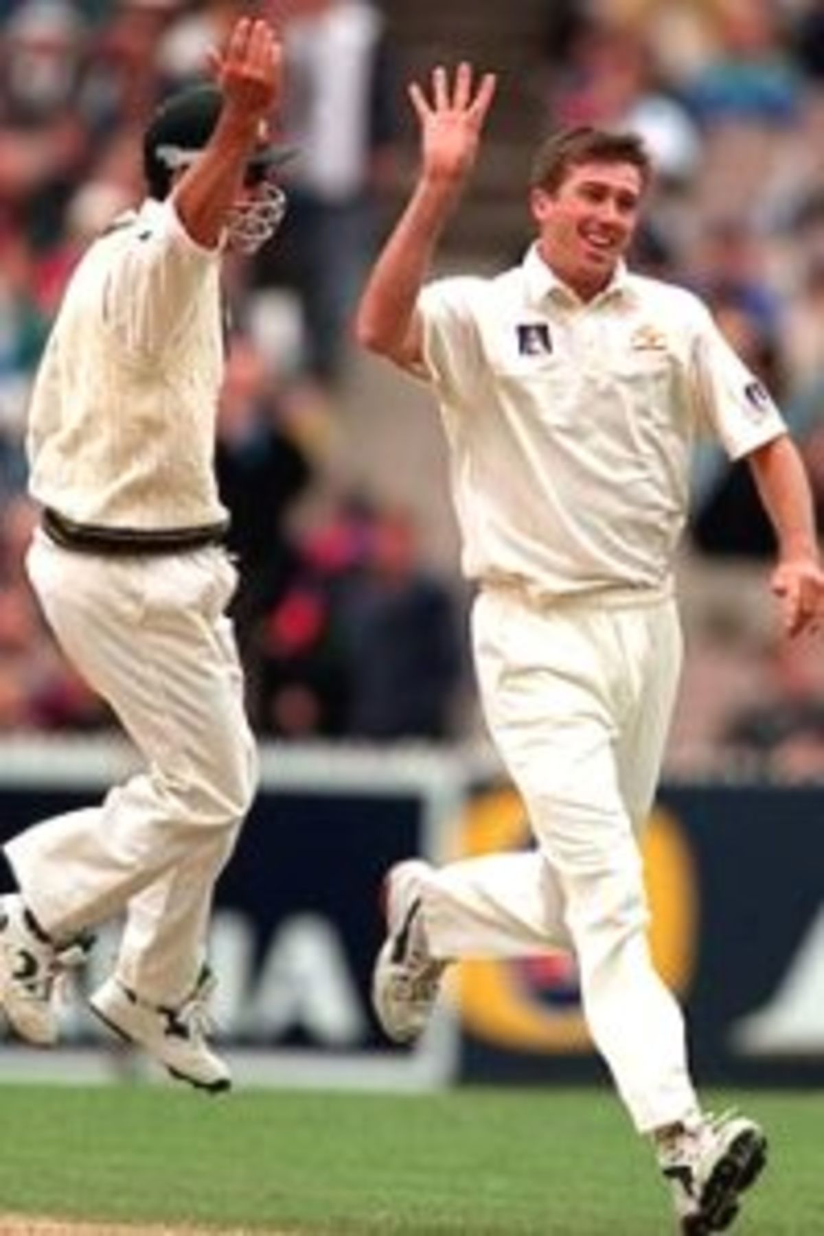 28 Dec 1999: Justin Langer of Australia congratulates team mate Glenn McGrath after taking the wicket of VVS Laxman of India, on day three of the second test match between Australia and India, played at the Melbourne Cricket Ground, Melbourne, Australia. Laxman was dismissed for 5 runs, caught Mark Waugh, bowled Glenn McGrath.