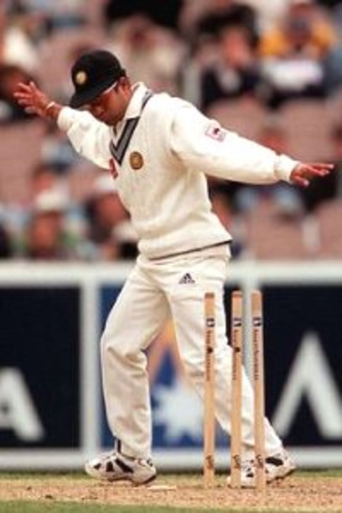 28 Dec 1999: Sachin Tendulkar of India stands over the stumps as Glenn McGrath of Australia is run out, on day three of the second test match between Australia and India, played at the Melbourne Cricket Ground, Melbourne, Australia. Glenn McGrath was run out for two runs.