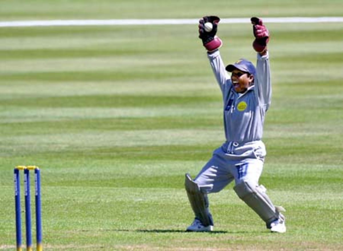 Sri Lankan wicket keeper Thanuja Ekanayake holds the ball she caught