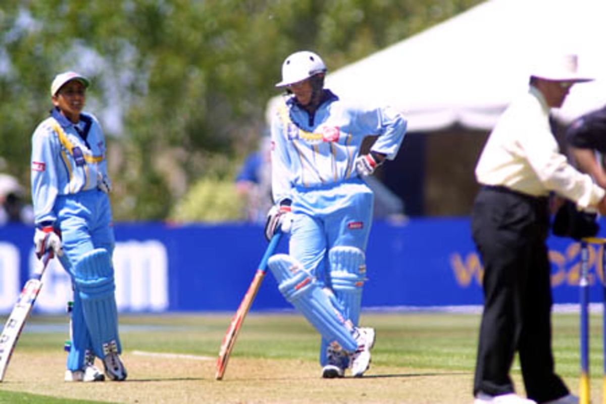 Anju Jain stands with Purnima Rao as they wait for the 3rd umpires