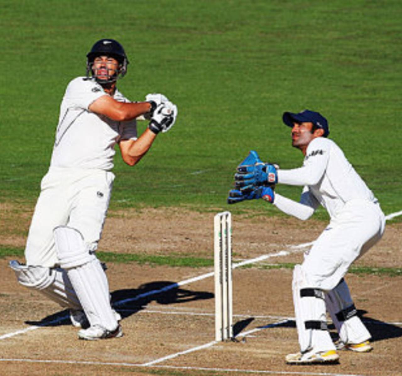 Ross Taylor goes on the attack as Dinesh Karthik looks on, New Zealand v India, 2nd Test, Napier, 1st day, March 26, 2009