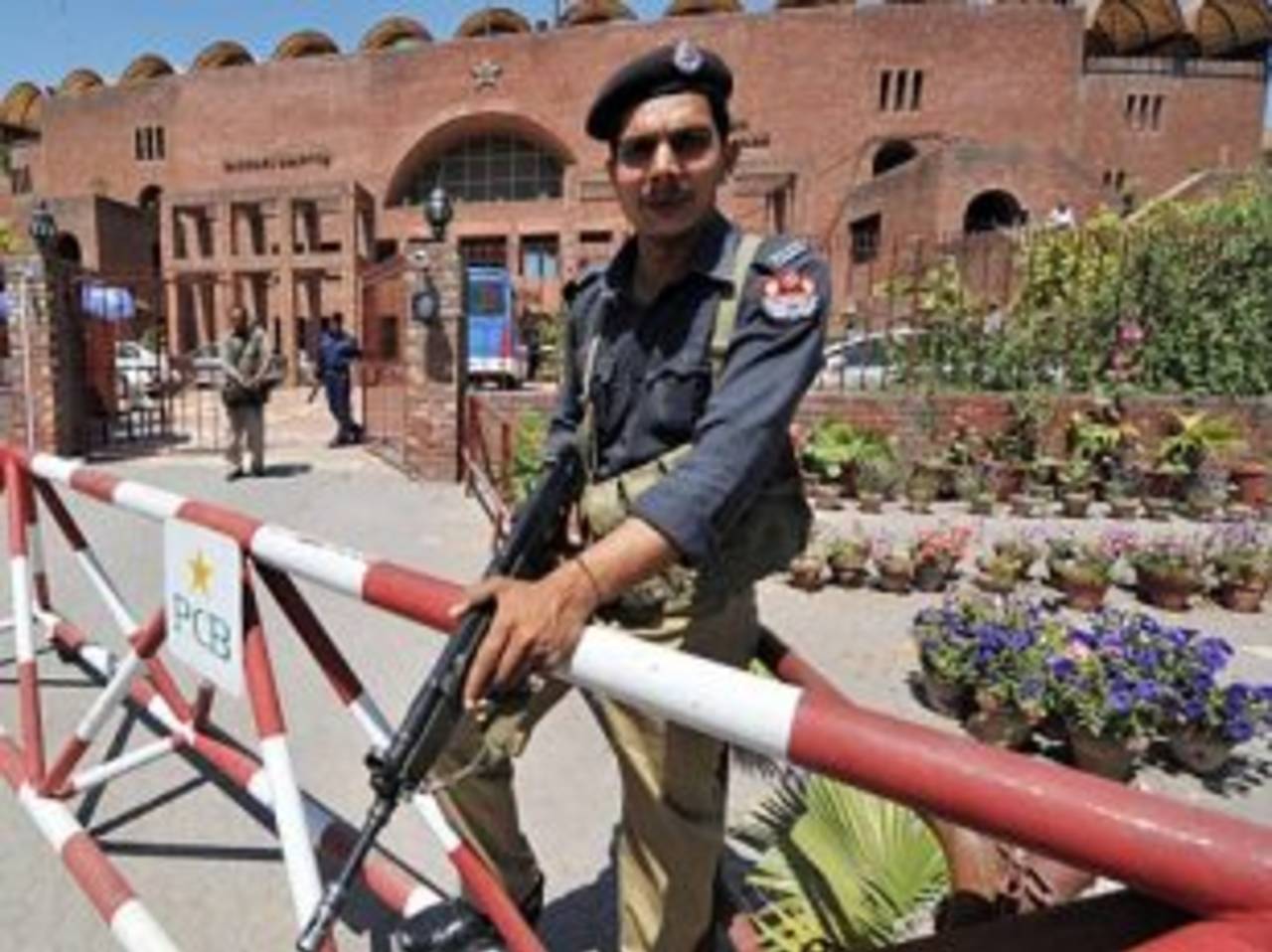 A security guard stands outside the Gaddafi Stadium, Lahore, April 10, 2009