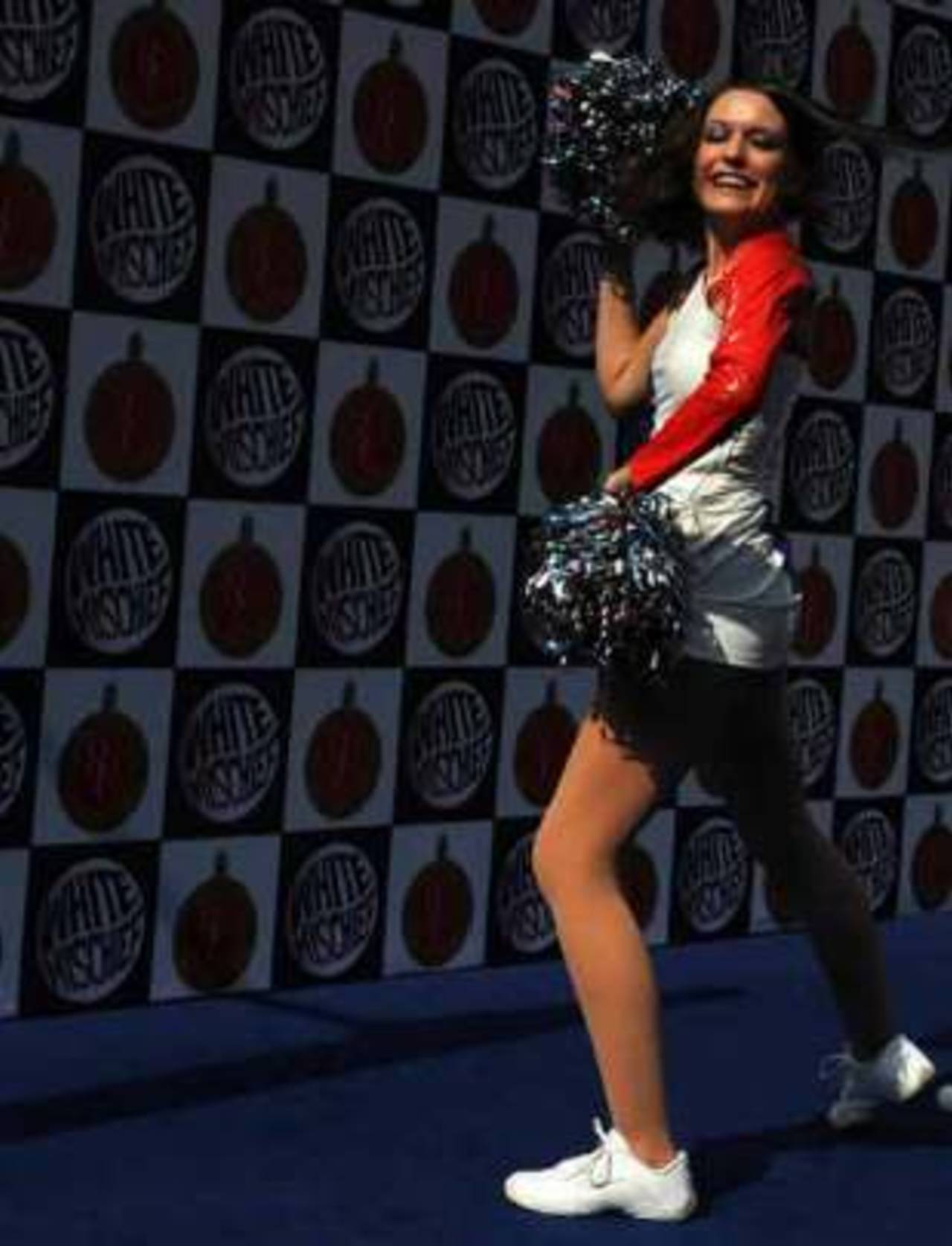 A cheerleader for the Bangalore Royal Challengers performs during a preview at the Chinnaswamy stadium, Bangalore, April 13, 2009