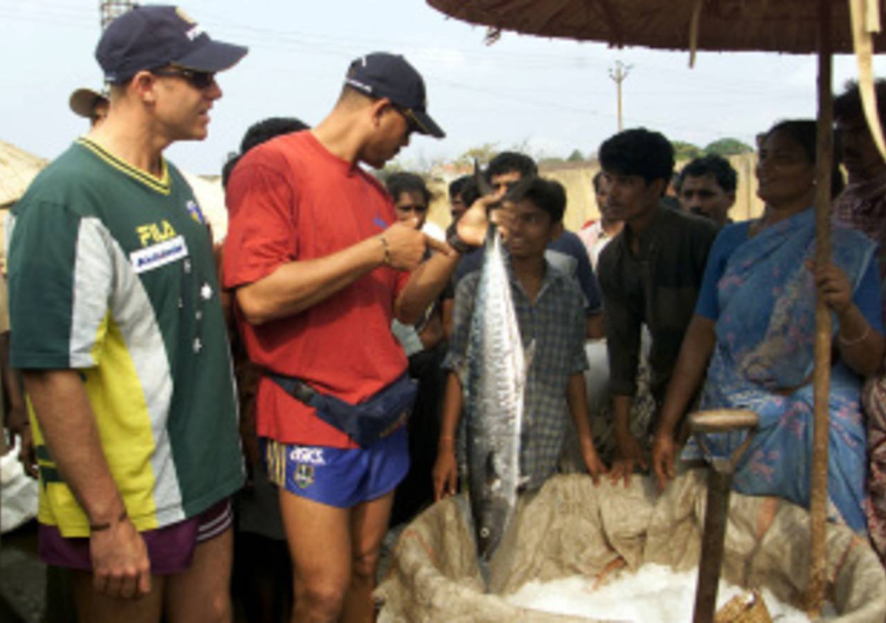Andrew Symonds examines some local fish, Visakhapatnam, April 2, 2001