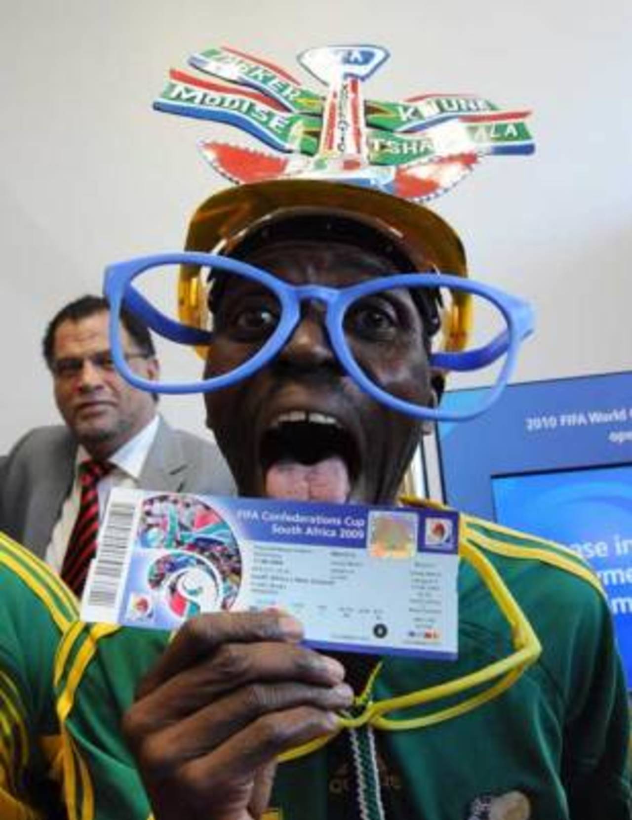 A football fan celebrates getting one of the first tickets for the Confederations Cup, Johannesburg, April 29, 2009