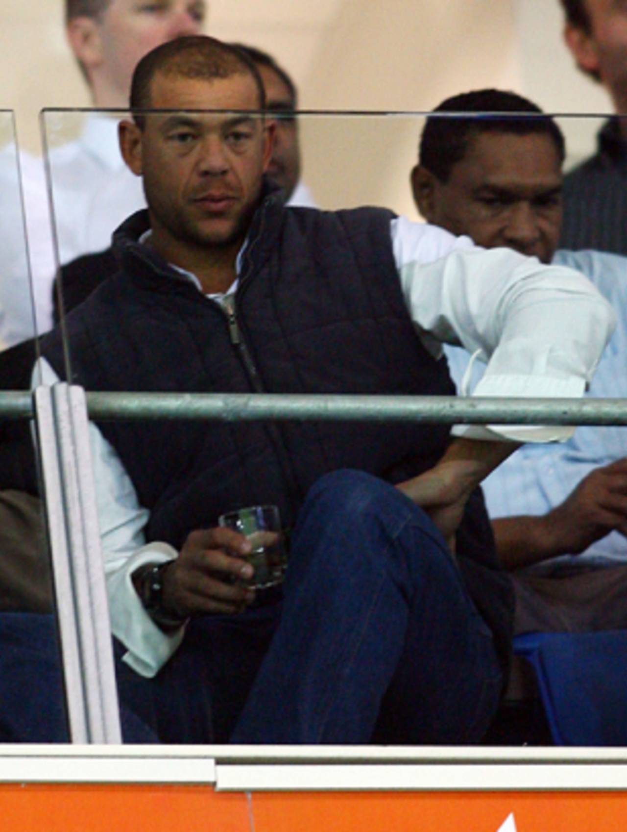 Andrew Symonds enjoys a drink while watching an NRL match, Gold Coast, June 8, 2009 