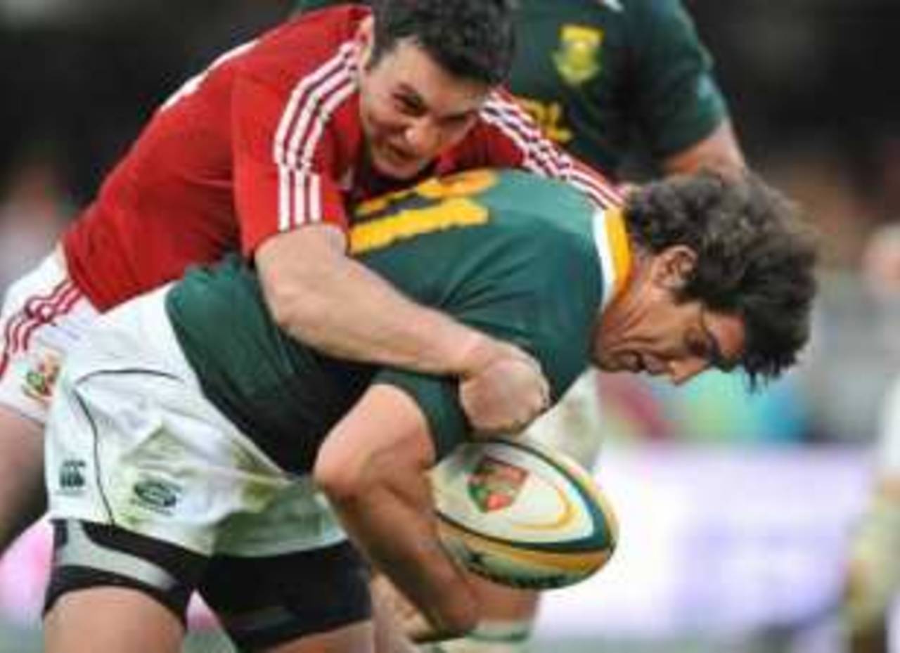 Jaque Fourie of South Africa is tackled by Stephen Jones of the British and Irish Lions, South African Springboks v British and Irish Lions, Kings Park Stadium, Durban, South Africa, June 20, 2009
