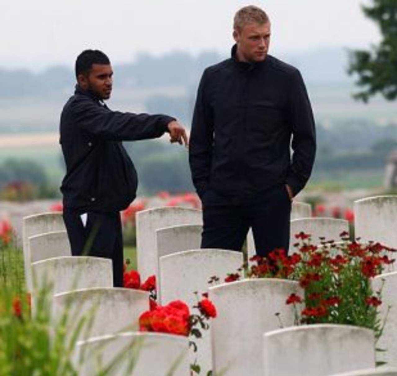 Adil Rashid and Andrew Flintoff at a First World War grave site during a trip to Flanders&nbsp;&nbsp;&bull;&nbsp;&nbsp;Getty Images