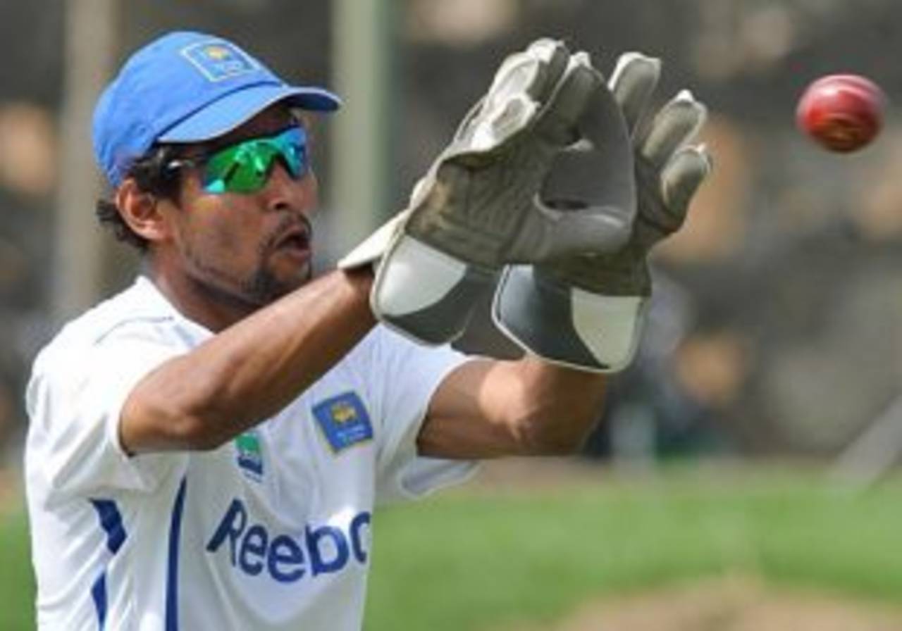 Tillakaratne Dilshan tries on wicketkeeping gloves, Galle, July 3, 2009