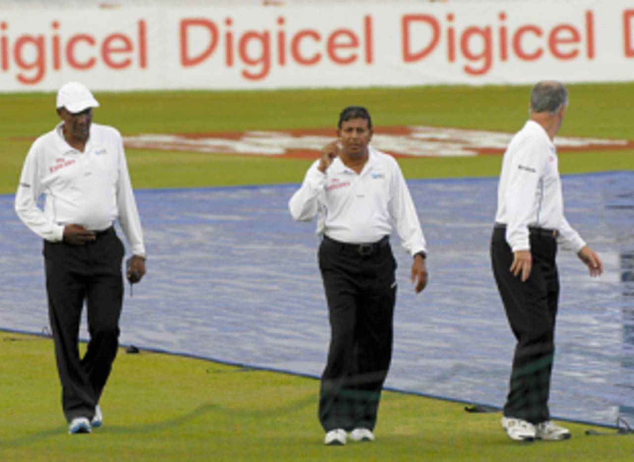 Reserve umpire Clyde Duncan inspects the field with Asoka de Silva and Tony Hill during Bangladesh's tour of West Indies in 2009&nbsp;&nbsp;&bull;&nbsp;&nbsp;AFP