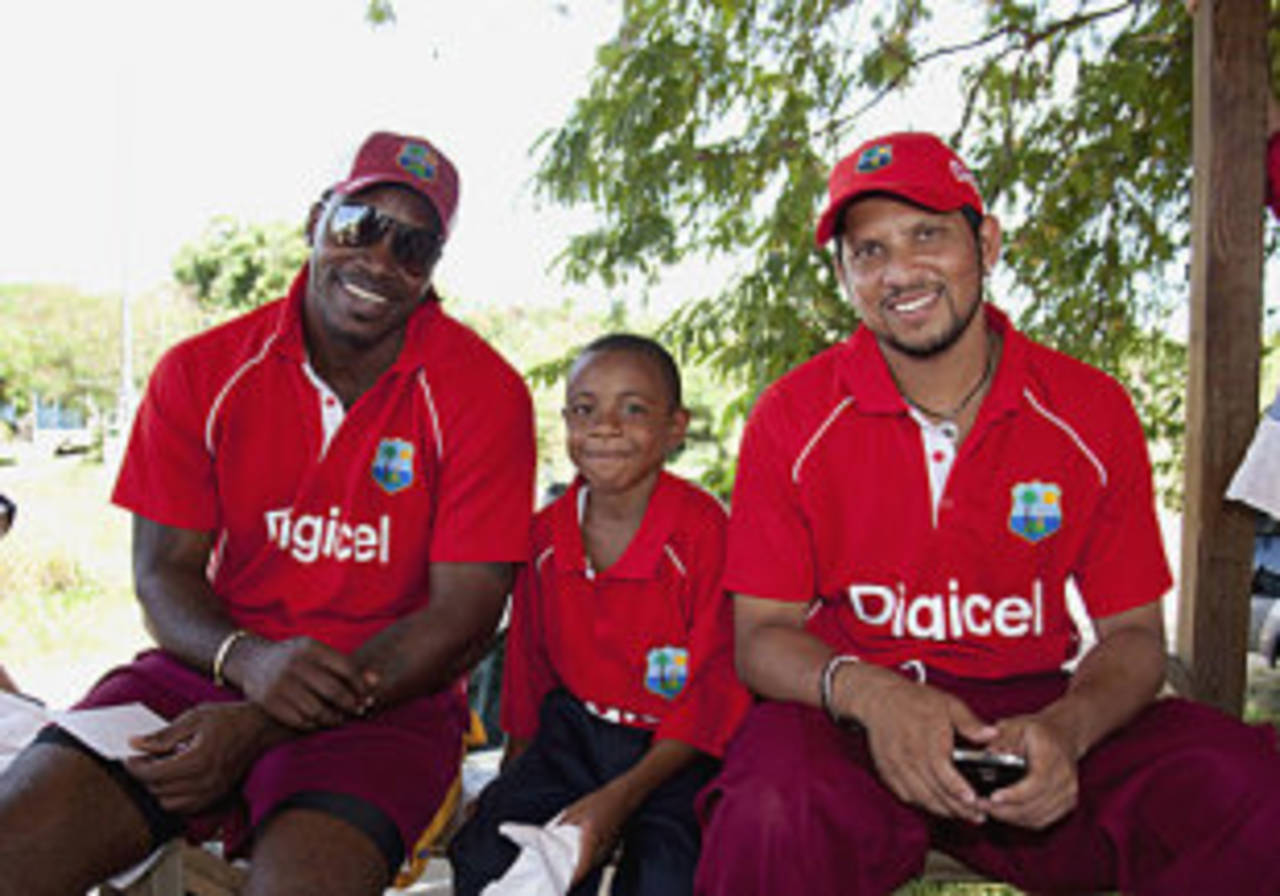 Chris Gayle and Ramnaresh Sarwan with Ronaldo Gomes, a participant from the Digicel Coaching Clinic, Tortola, British Virgin Islands, August 31, 2009