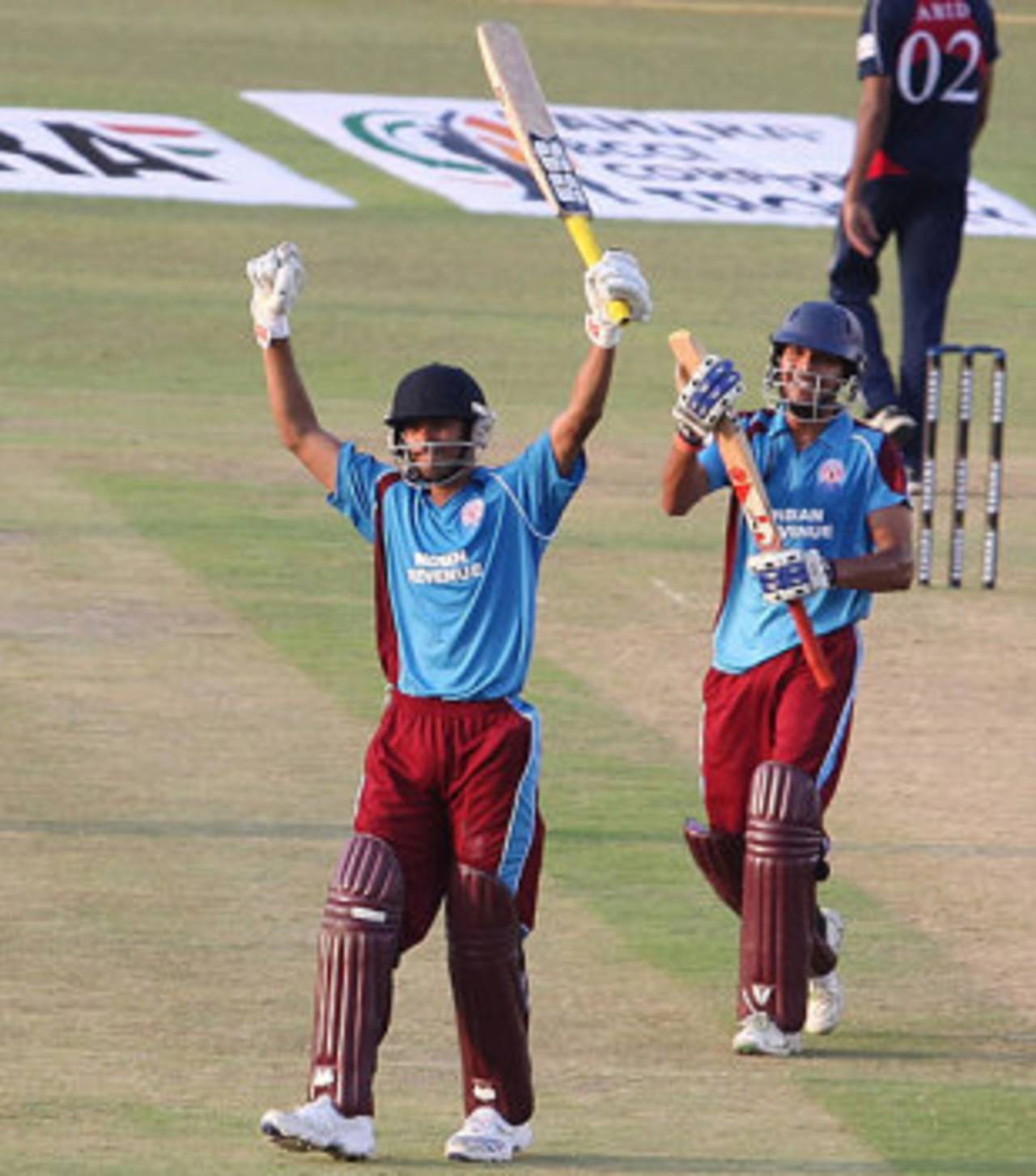 Avik Chaudhary raises the bat after reaching his century, Indian Revenue v Indian Tobacco Company, BCCI Corporate Trophy, Mohali, September 2, 2009
