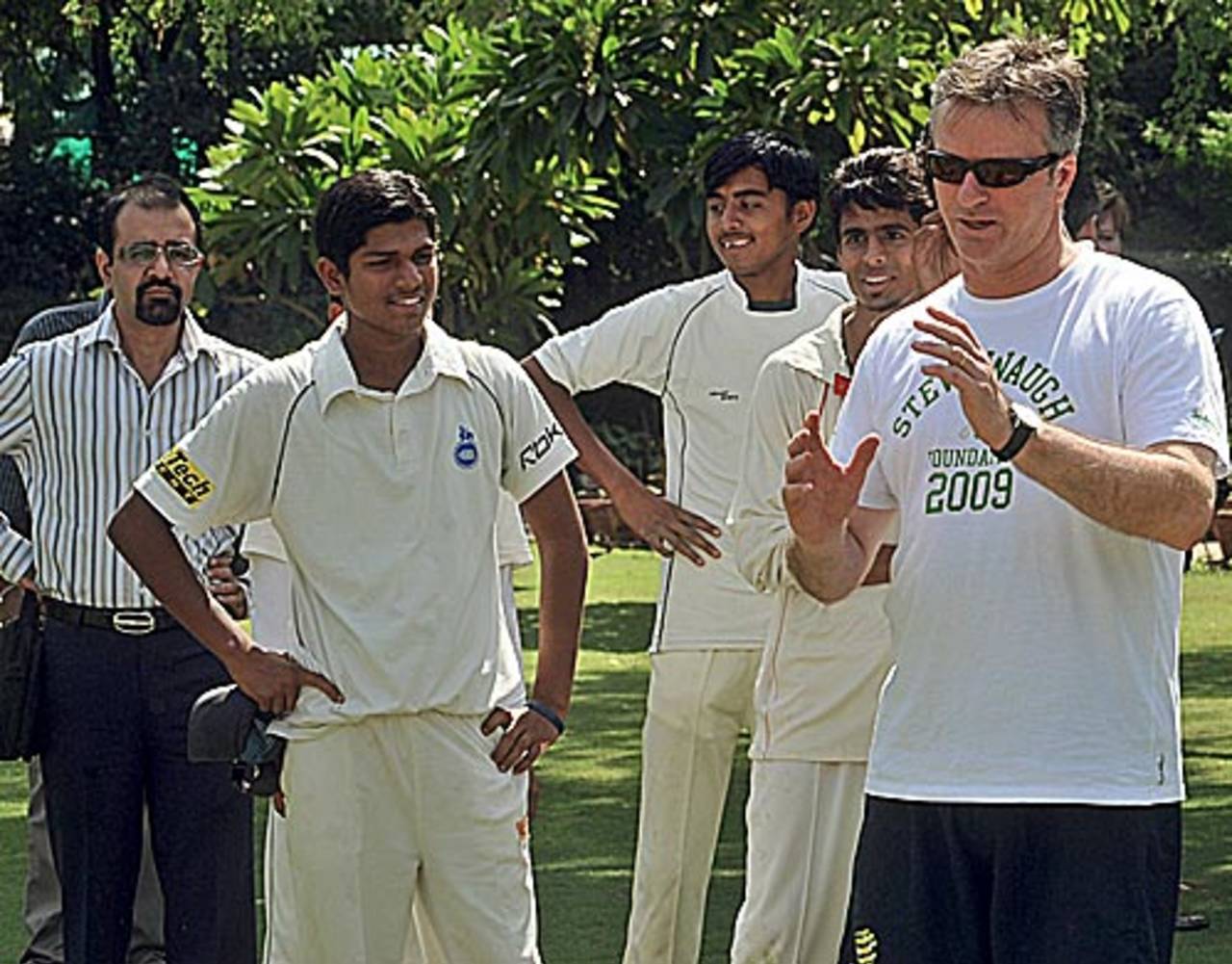 Steve Waugh talks to aspiring cricketers during a coaching camp, New Delhi, India