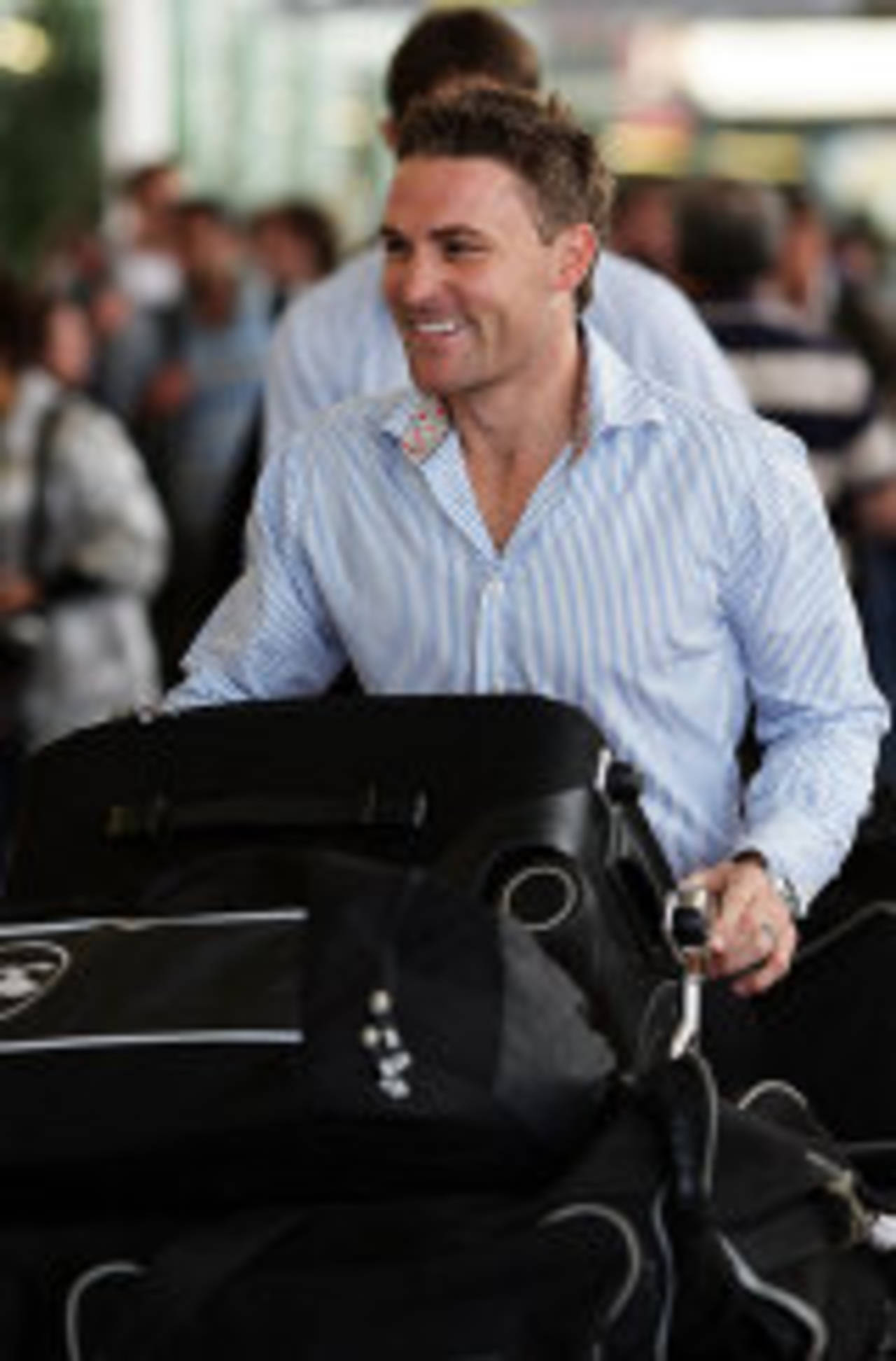 Brendon McCullum wheels in his luggage at the airport, Auckland, October 27, 2009