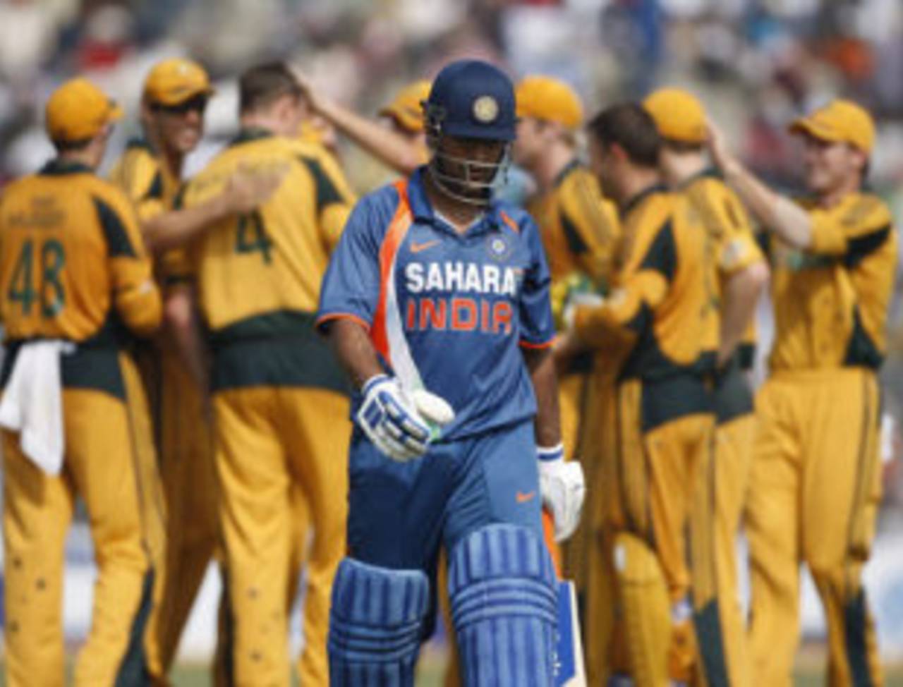 Australia celebrate as MS Dhoni trudges off the field, India v Australia, 6th ODI, Guwahati, November 8, 2009