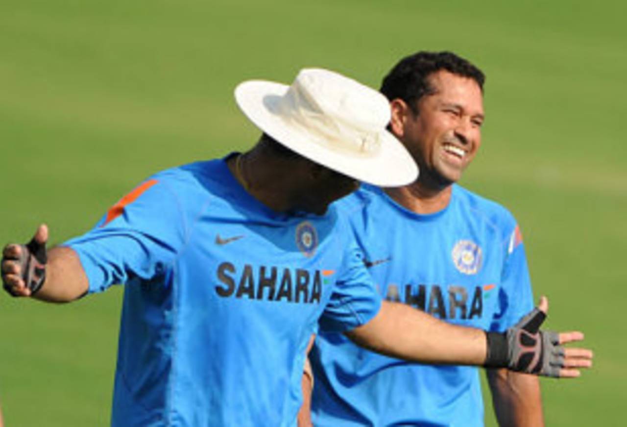 Virender Sehwag and Sachin Tendulkar share a light moment during a net session, Ahmedabad, November 15, 2009
