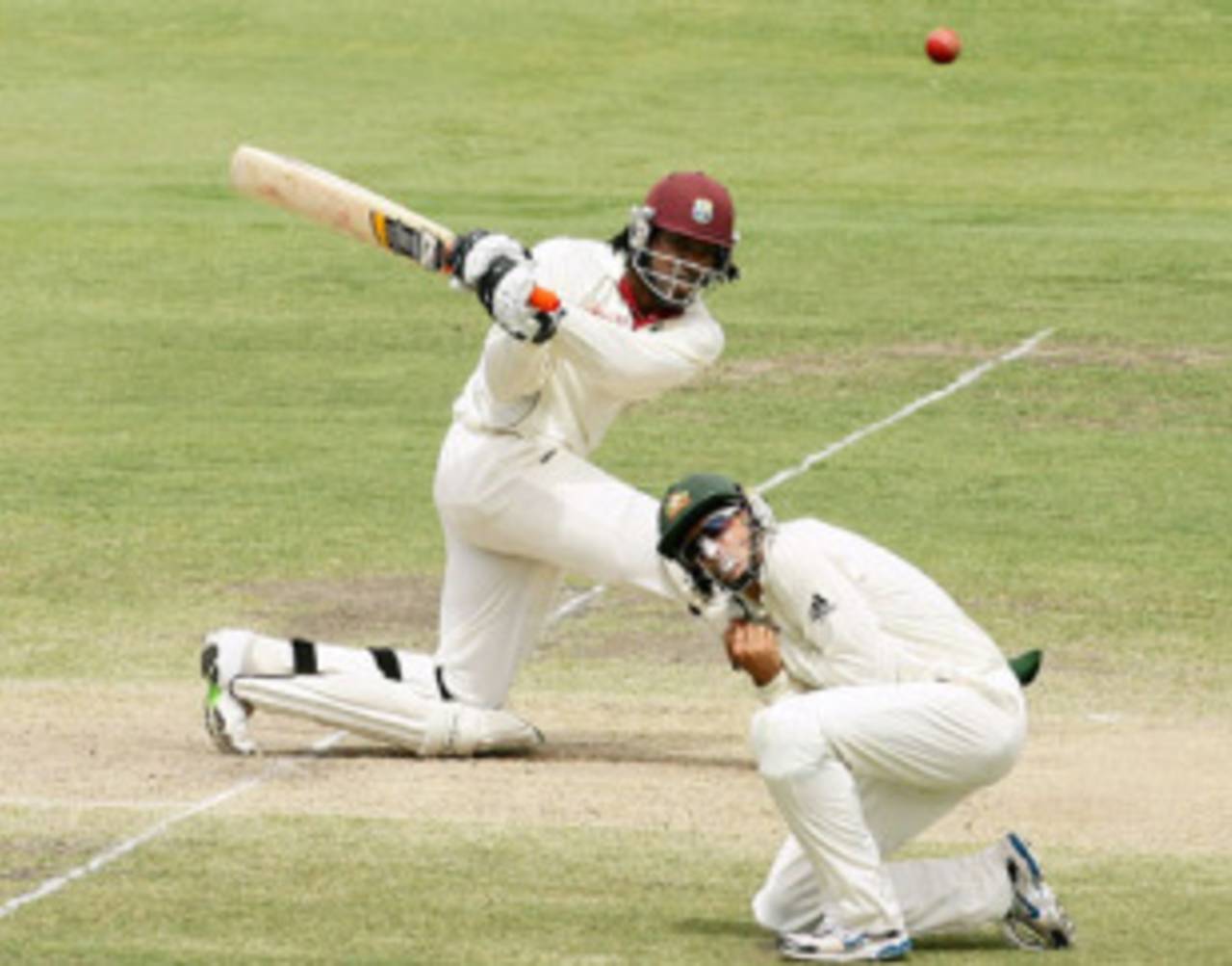Chris Gayle sweeps as Michael Hussey takes cover, Australia v West Indies, 2nd Test, Adelaide