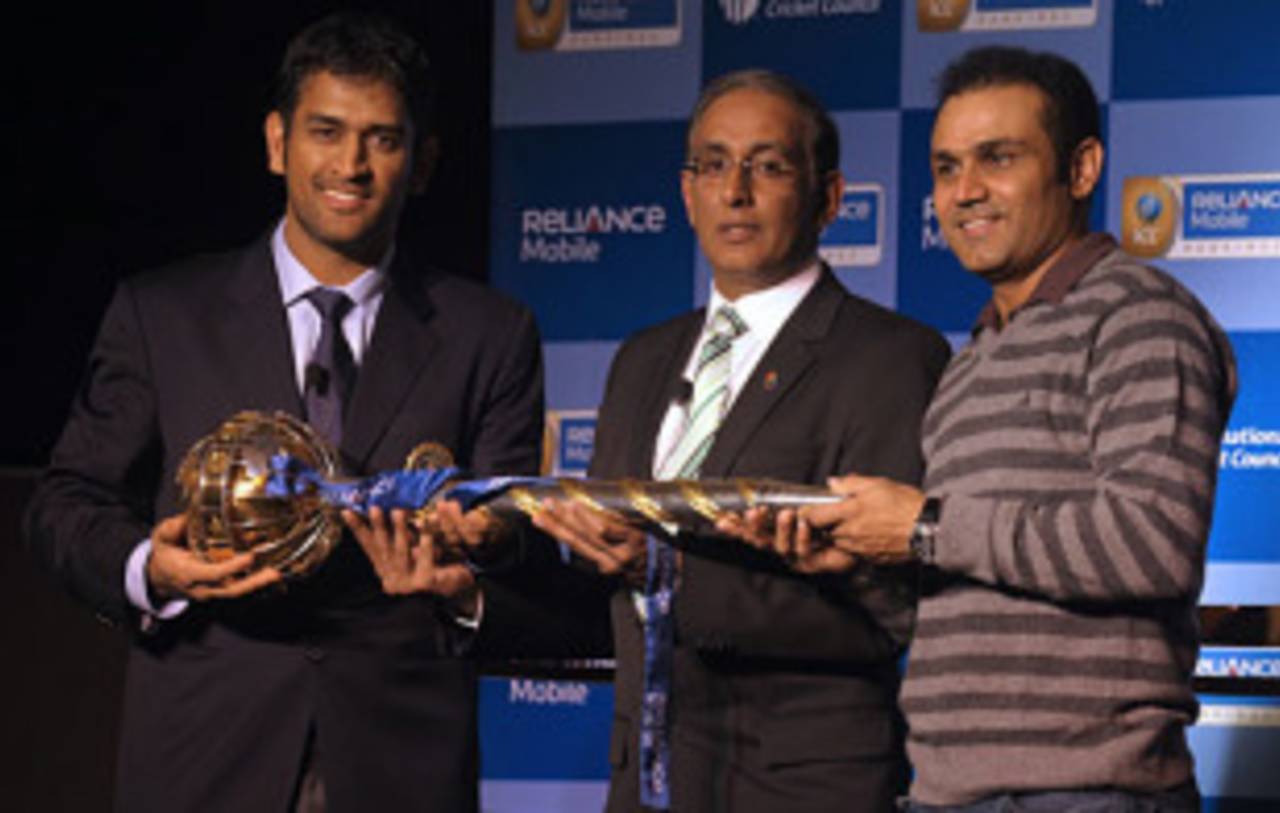MS Dhoni, Virender Sehwag and Haroon Lorgat pose with the  ICC Test Championship mace pose with the  ICC Test Championship mace, New Delhi, December 27, 2009