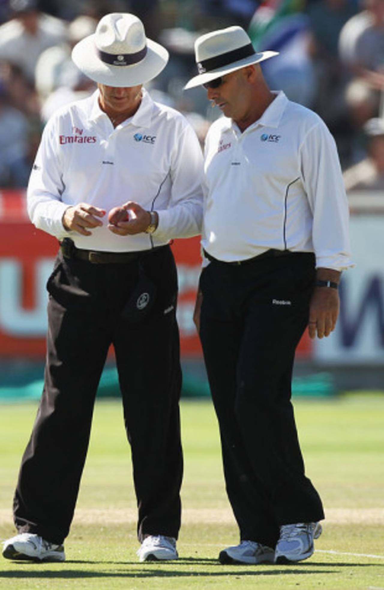 The umpires, Tony Hill and Daryl Harper, examine the ball after it was stepped on by Stuart Broad&nbsp;&nbsp;&bull;&nbsp;&nbsp;Getty Images