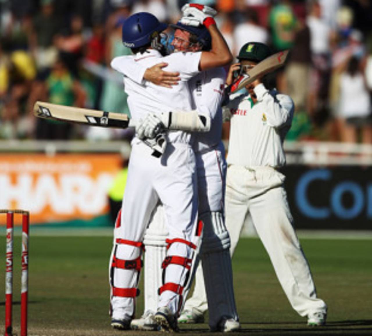 Graham Onions and Graeme Swann embrace after seeing out 17 balls to save England the Test, England v South Africa, 3rd Test, Cape Town, January 7, 2010
