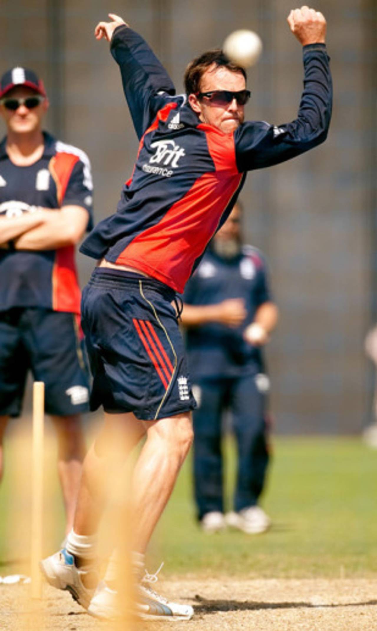 Graeme Swann loosens up during England's training session in Dubai, February 16, 2010