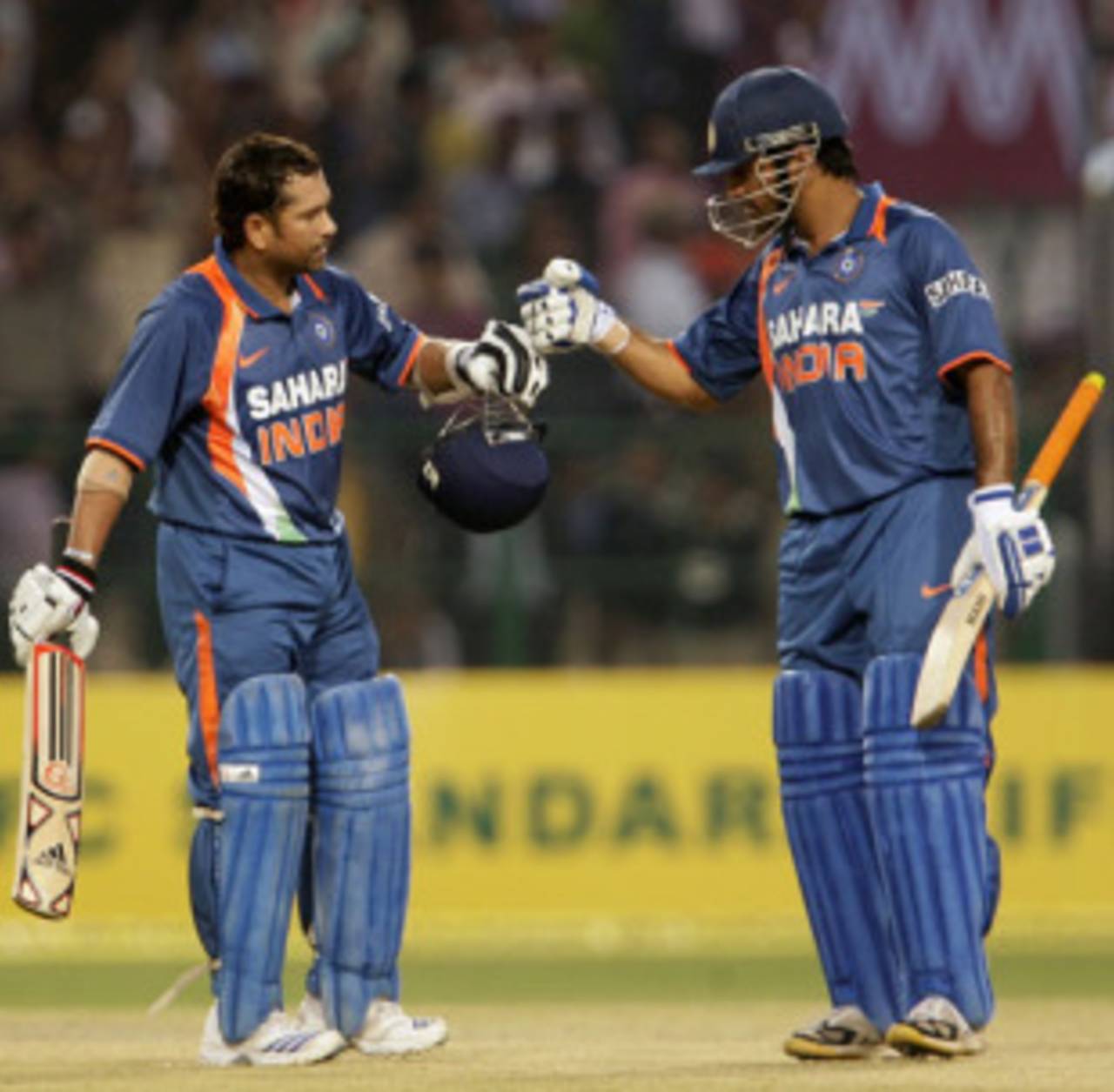 Sachin Tendulkar is congratulated by MS Dhoni after rewriting the record books, 2nd ODI, Gwalior, February 24, 2010
