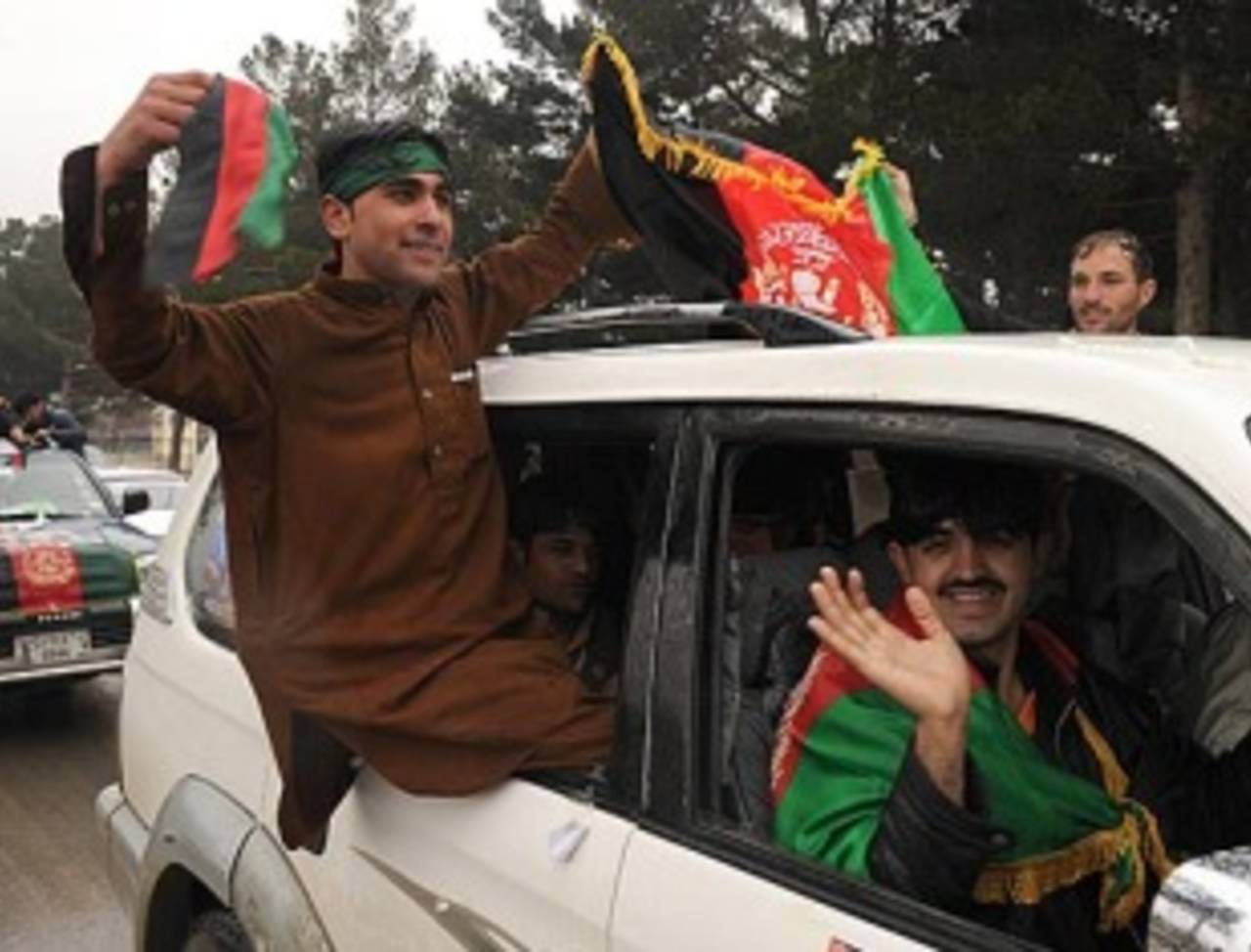 Flag-waving Afghanistan fans celebrate their team's arrival in Kabul&nbsp;&nbsp;&bull;&nbsp;&nbsp;AFP