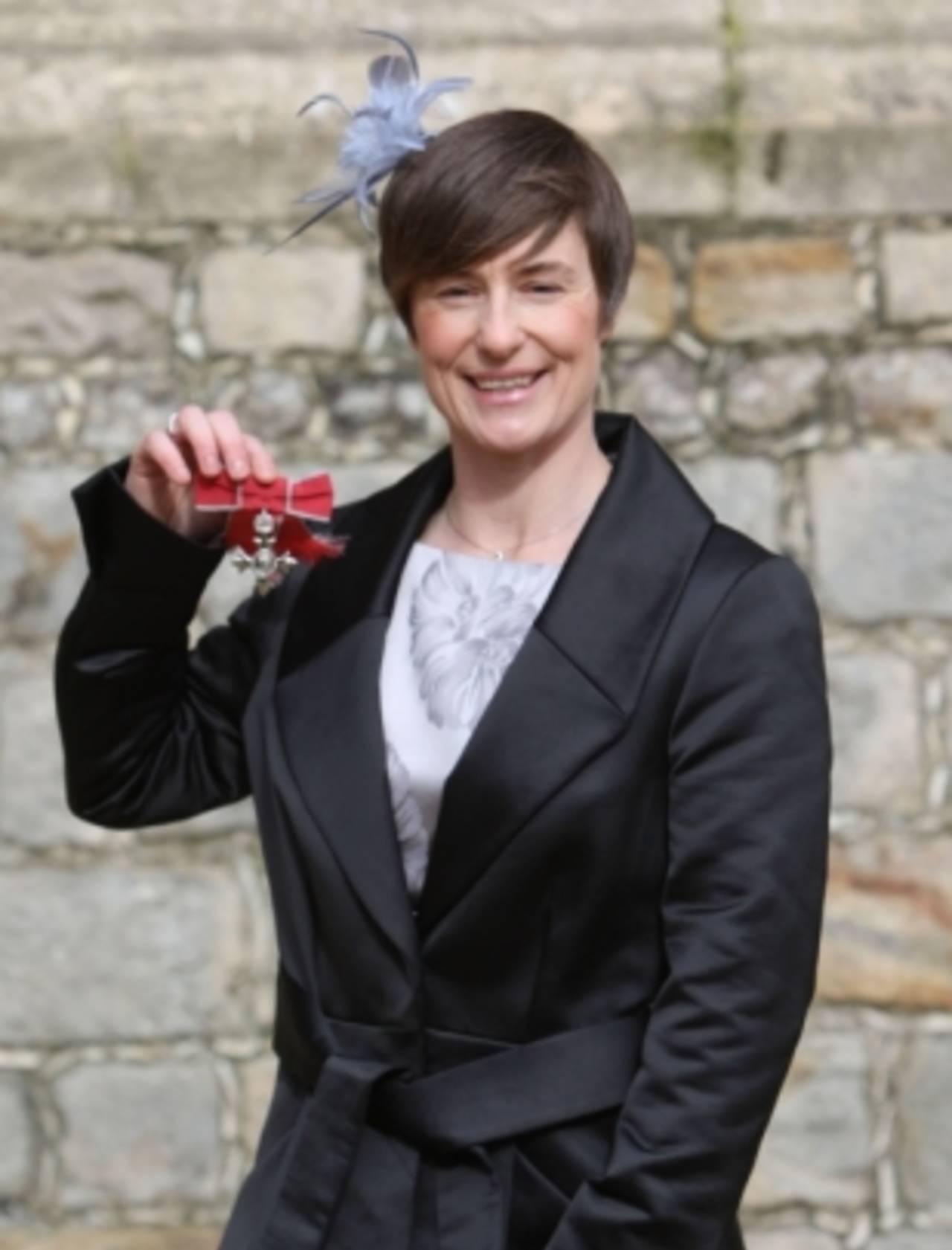 England cricketer Claire Taylor poses with her MBE, February 26, 2010