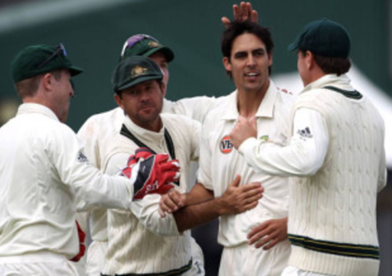 Mitchell Johnson is congratulated by his team-mates after his first wicket, New Zealand v Australia, 2nd Test, Hamilton, 4th day, March 30, 2010