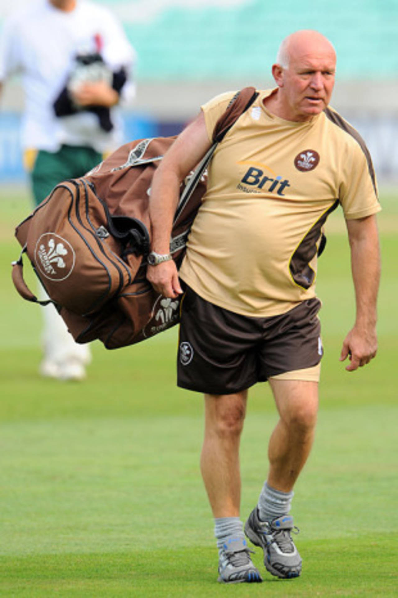 Surrey's coach Alan Butcher leaves the field of play with a kit bag on his shoulder, The Oval, September 17, 2008