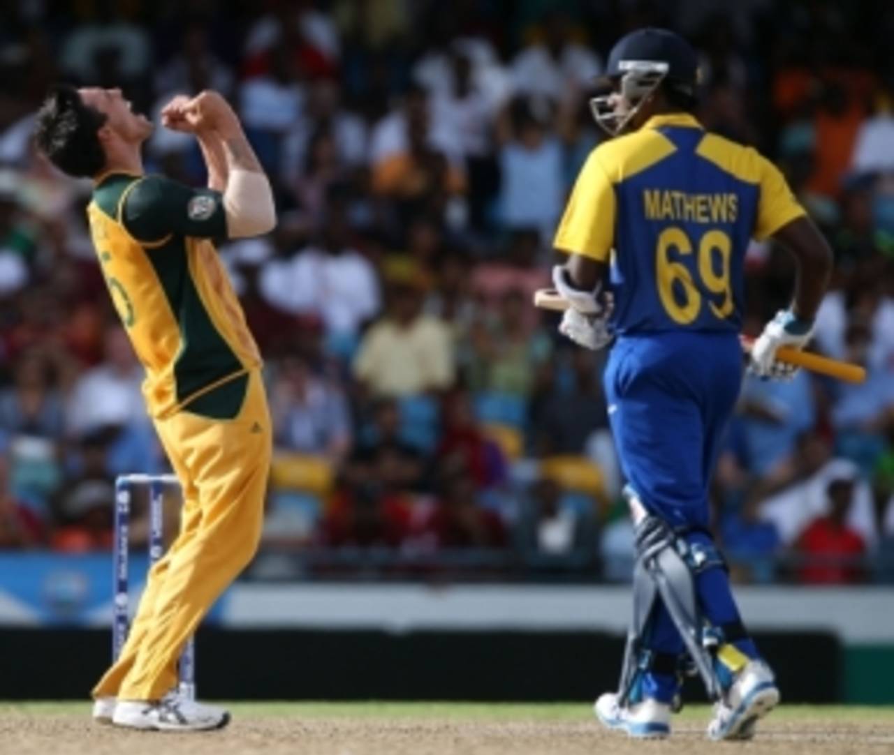 Mitchell Johnson celebrates the second of the two wickets he took in his first over as Angelo Mathews trudges off, Australia v Sri Lanka, World T20, Group F, Bridgetown, May 9, 2010