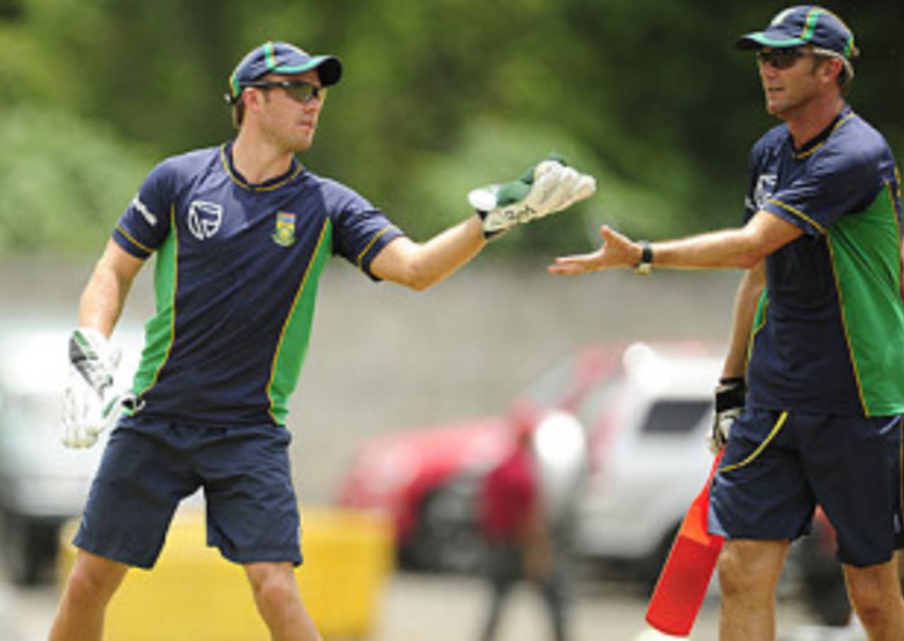 AB de Villiers passes a ball to coach Corrie van Zyl during practice, Roseau, May 27, 2010
