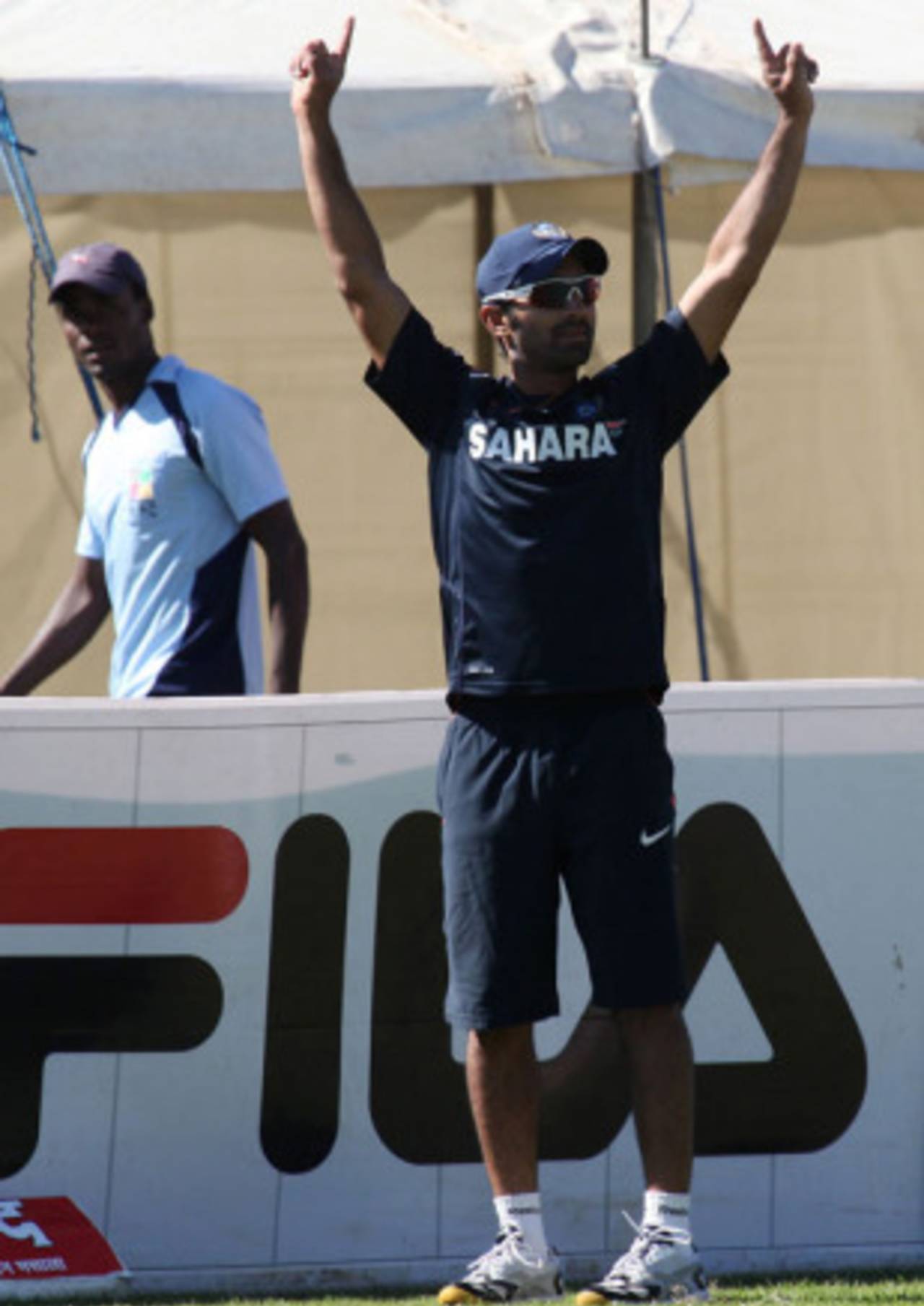 Dinesh Karthik signals six during practice ahead of the first Twenty20, Harare, June 11, 2010