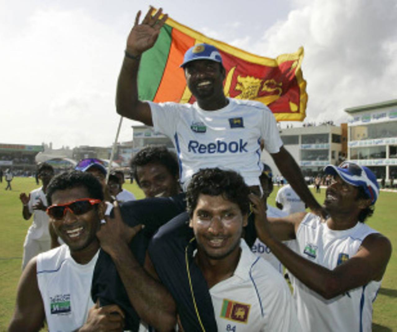 Muttiah Muralitharan is carried off the field by Kumar Sangakkara and Dammika Prasad, Sri Lanka v India, 1st Test, Galle, 5th day, July 22, 2010