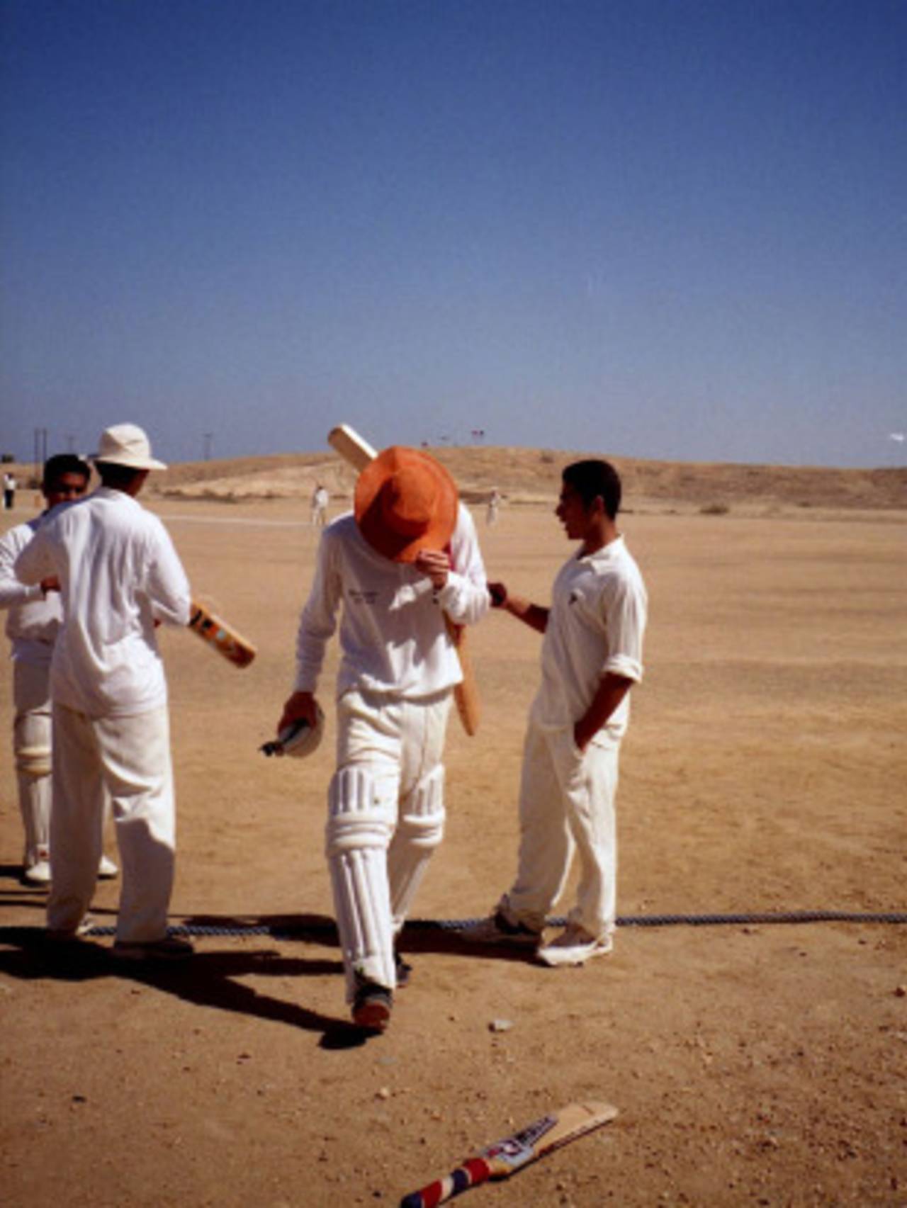 Playing cricket in Oman