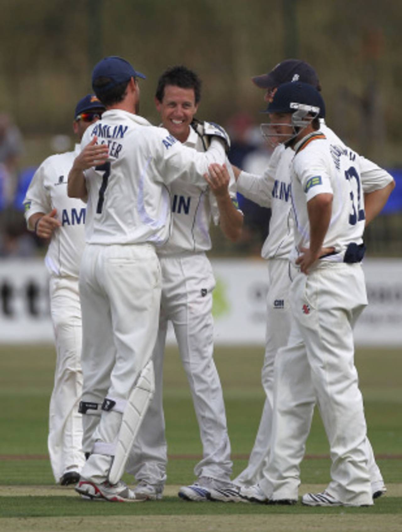 Bryce McGain is congratulated by his Essex team-mates after collecting four wickets, Essex v Warwickshire, County Championship Division One, Southend-on-Sea, August 5 2010 
