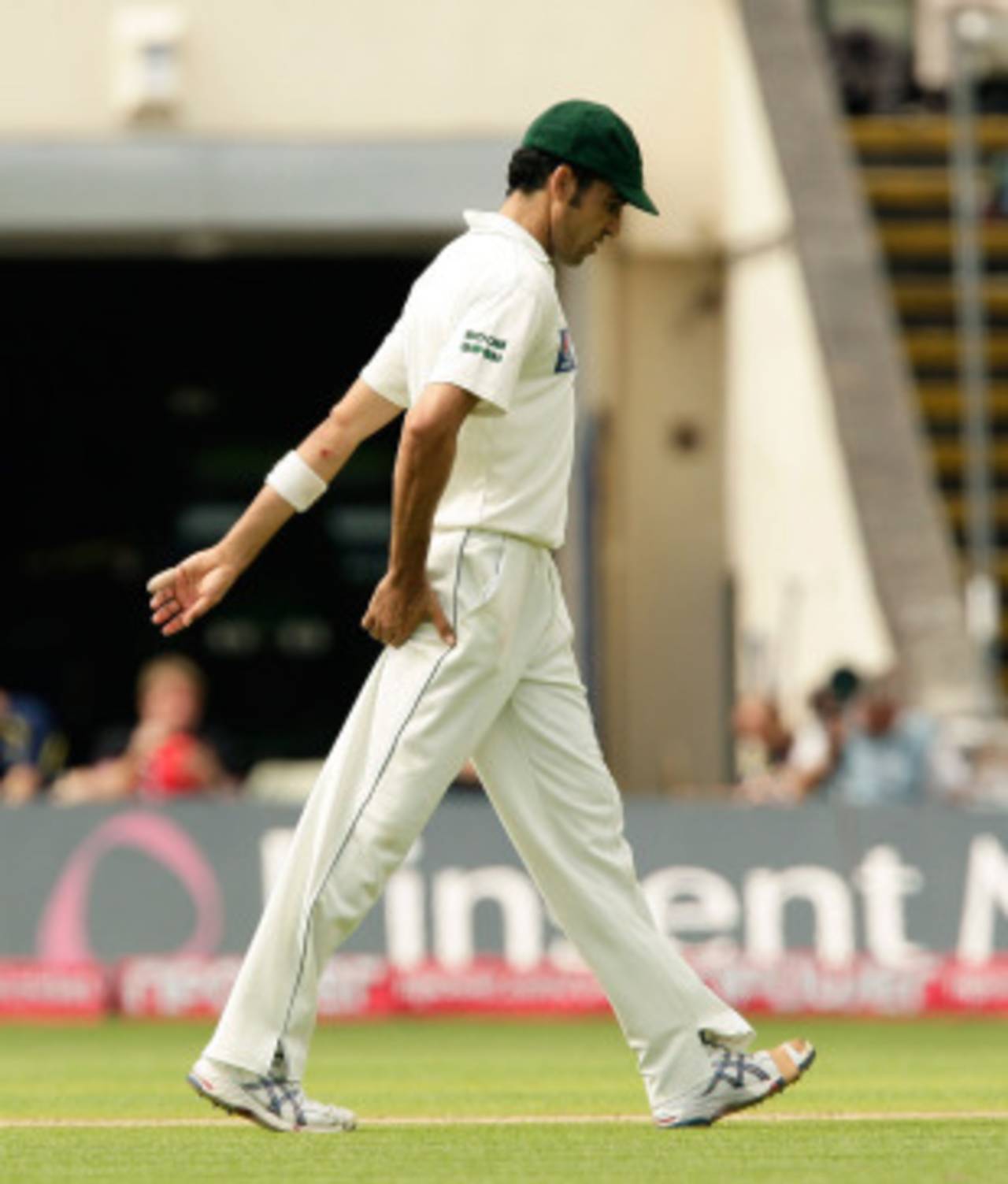 Umar Gul walks from the fielding holding his leg, England v Pakistan, 2nd Test, Edgbaston, August 7, 2010`