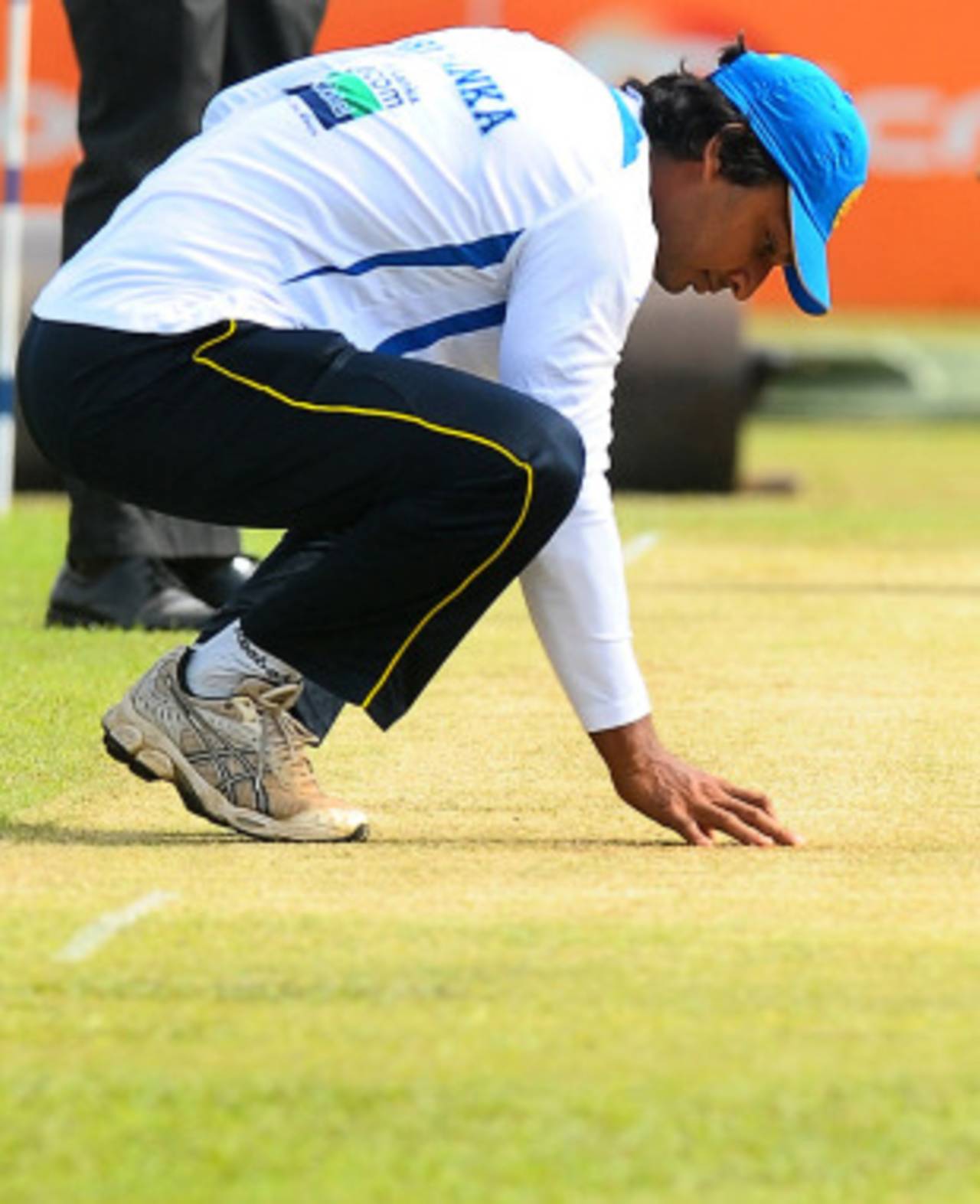Kumar Sangakkara checks the pitch, Colombo, August 2, 2010