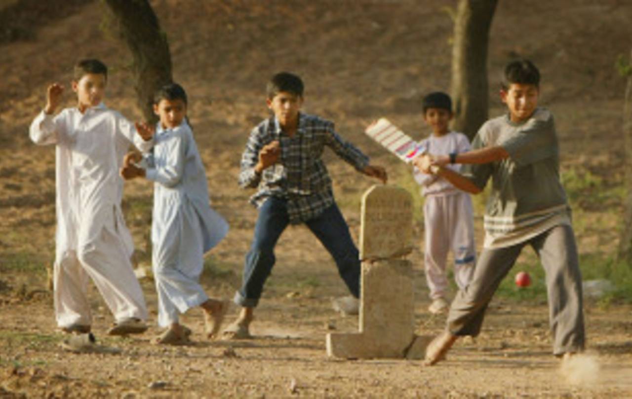  Children play street cricket, Rawalpindi, March 21, 2004 