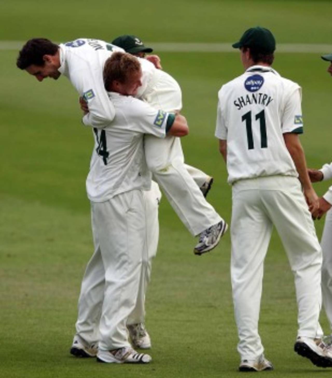 Gareth Andrew lifts up Daryl Mitchell as they celebrate Rory Hamilton-Brown's dismissal, Worcestershire v Surrey, County Championship, Division Two, New Road, August 17, 2010