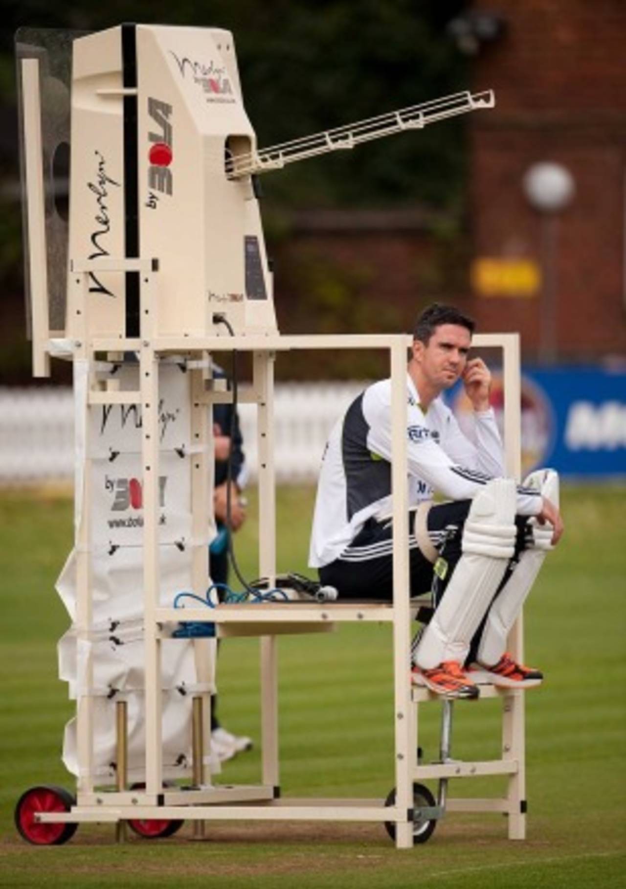 Kevin Pietersen contemplates the final Test while sat on Merlin the bowling machine, Lord's, August 25, 2010