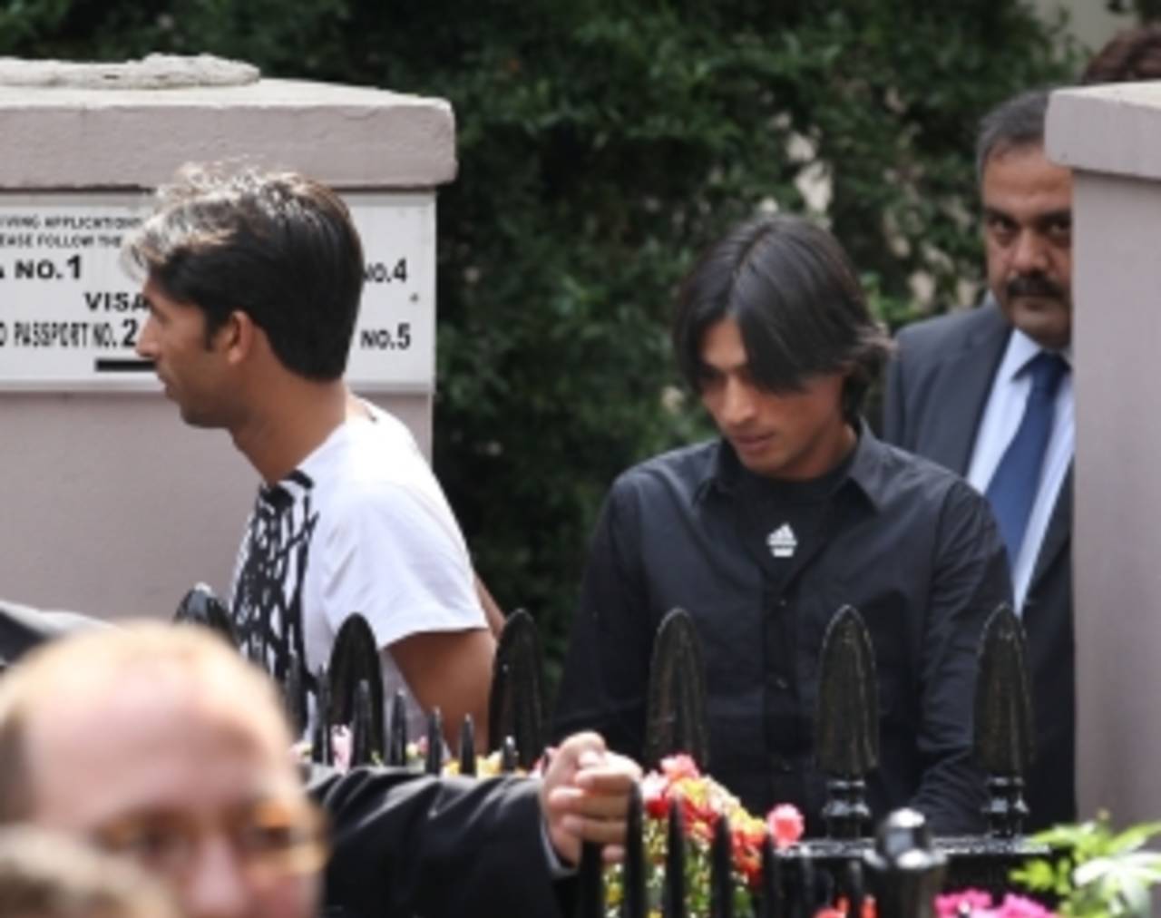 Mohammad Asif and Mohammad Amir left the Pakistan High Commission via a rear exit to avoid a throng of reporters, September 2, 2010