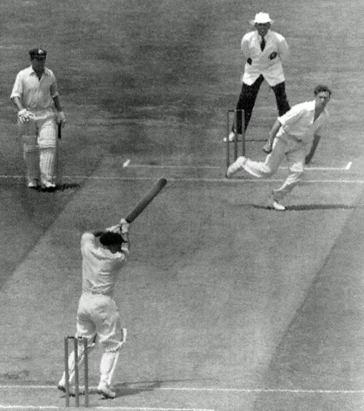Les Favell cuts a ball Brian Statham as his team-mate Arthur Morris looks on, Australia v England, 3rd Test, MCG, 2nd day, January 1, 1955