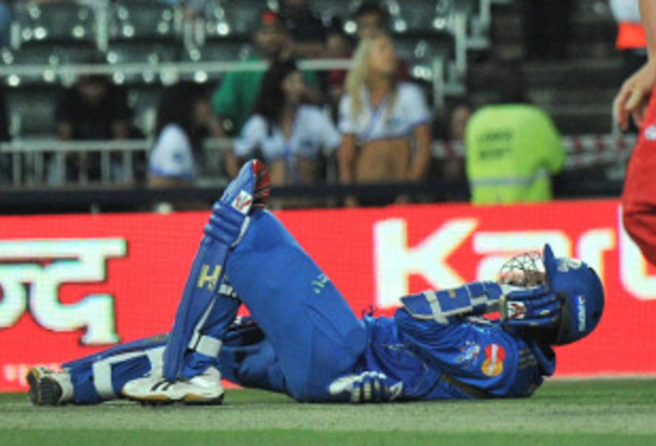 Harbhajan Singh goes down in pain after inside-edging a full toss onto his back knee, Lions v Mumbai, Champions League Twenty20, Johannesburg, September 10, 2010