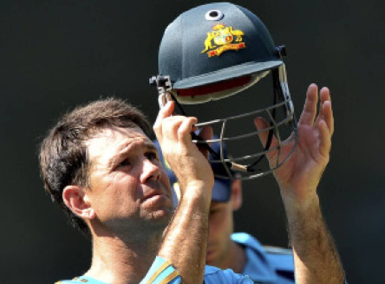 Ricky Ponting puts on his helmet before a session at the nets, Mohali, September 29, 2010