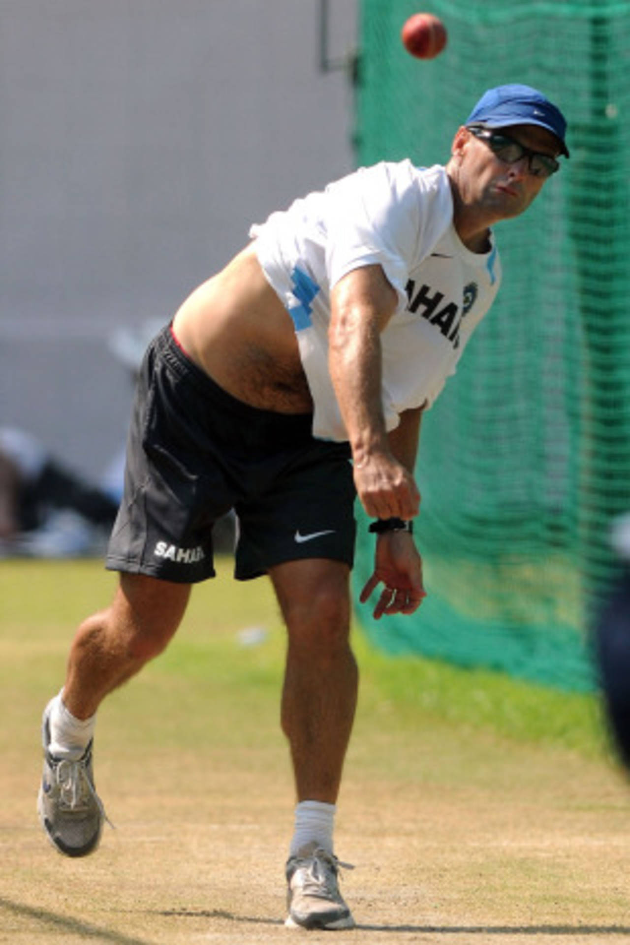 India coach Gary Kirsten rolls his arm over in the nets, Mohali, September 30, 2010